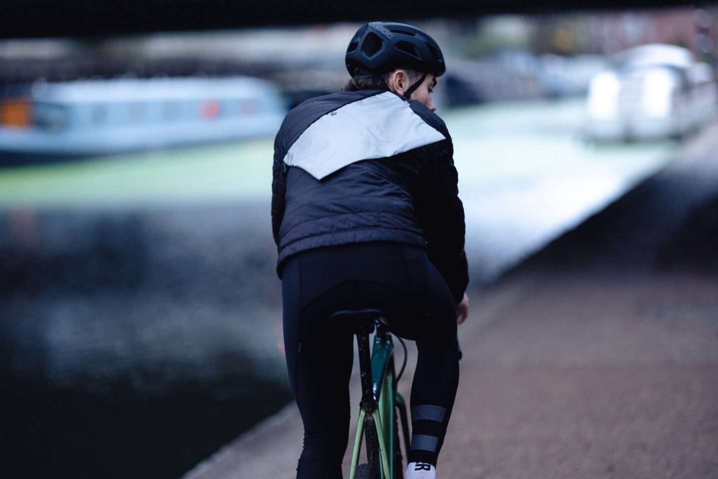 Man Cycles along Canal Wiz Viz Reflective Musette